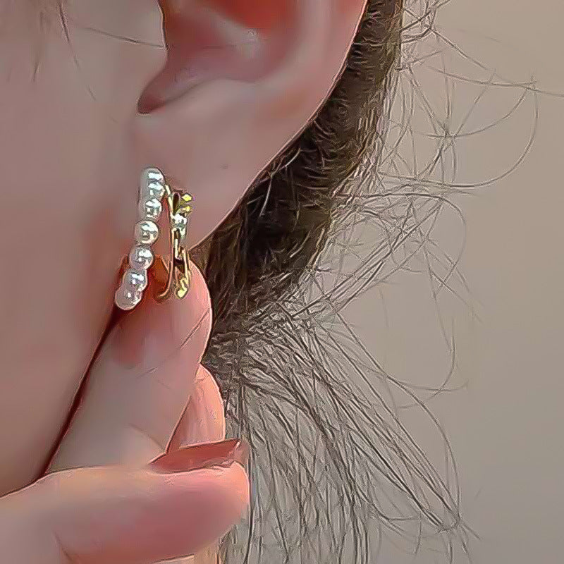 XP17 European and American hot-selling niche design sense retro pearl earrings creative unique metal stud earrings light luxury