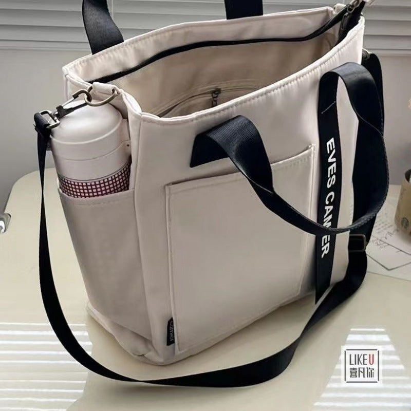 New Design Waterproof and Stylish Tote Canvas Hand Carry Messenger Bag Simple and Versatile Single Shoulder Portable Bento Lunch Box Bag